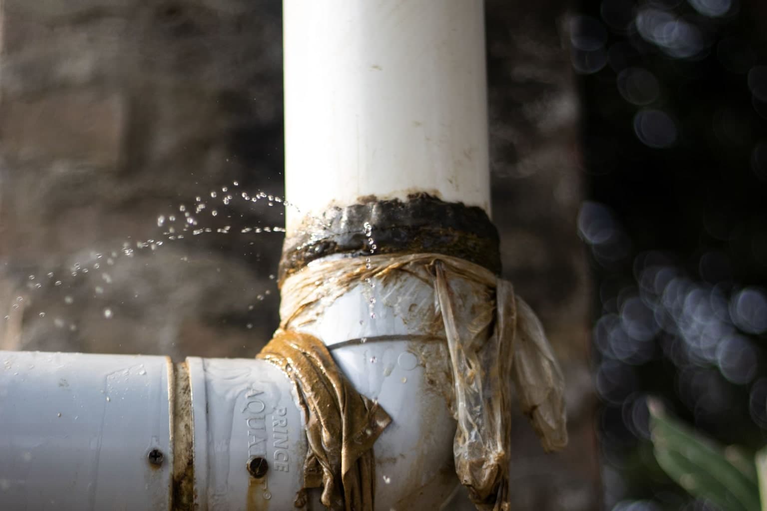 Water leaking from damaged residential drainage pipework