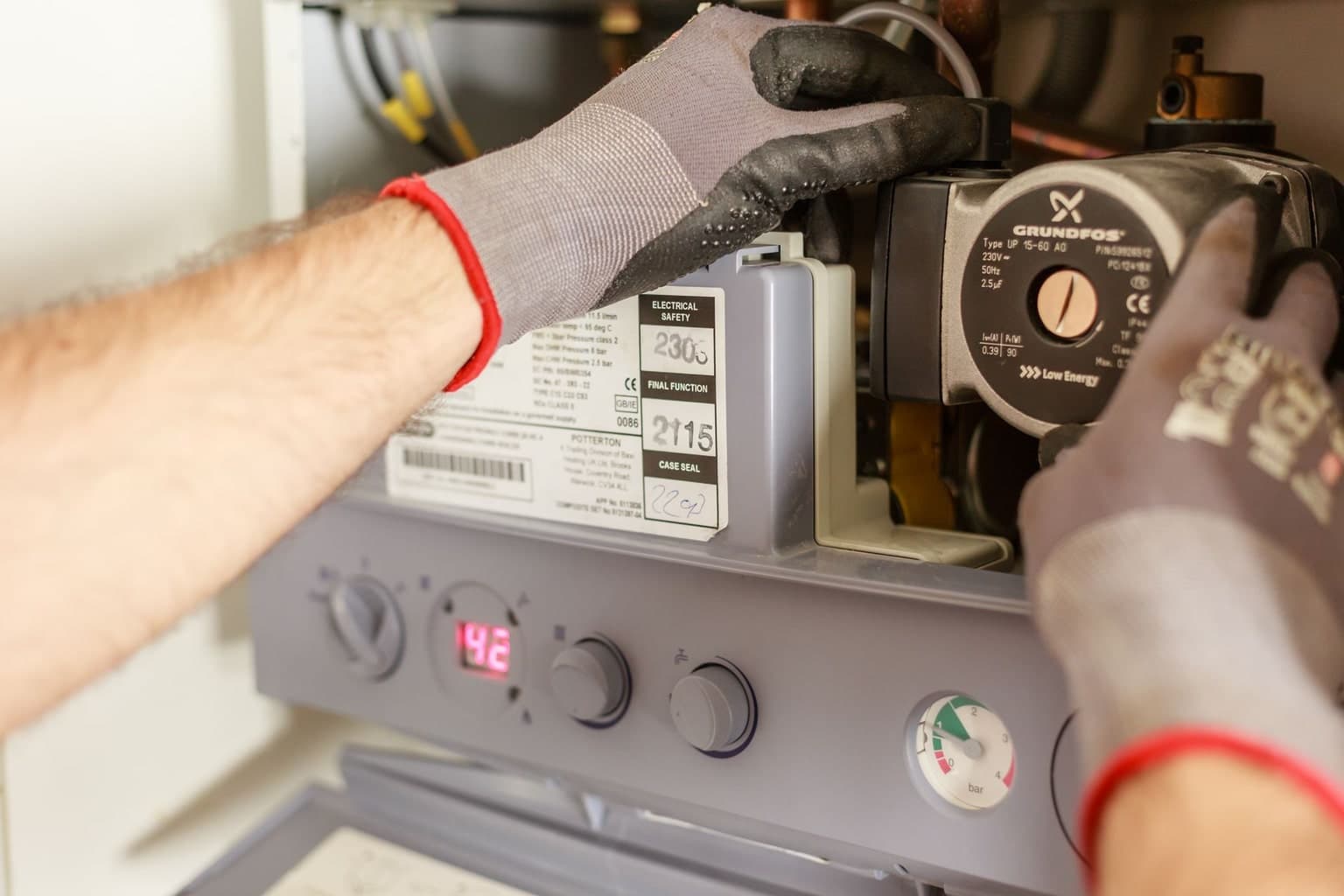 Technician servicing a domestic hot-water system